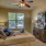 Bedroom with large window, ceiling fans and ensuite